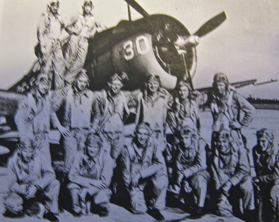 Lt. j.g. Bill Timmis is standing on the wing against the Curtis SB2C Helldiver. He was an instructor at Daytona Naval Air Station teaching this group of would-be Naval Aviators how to fly. Photo provided