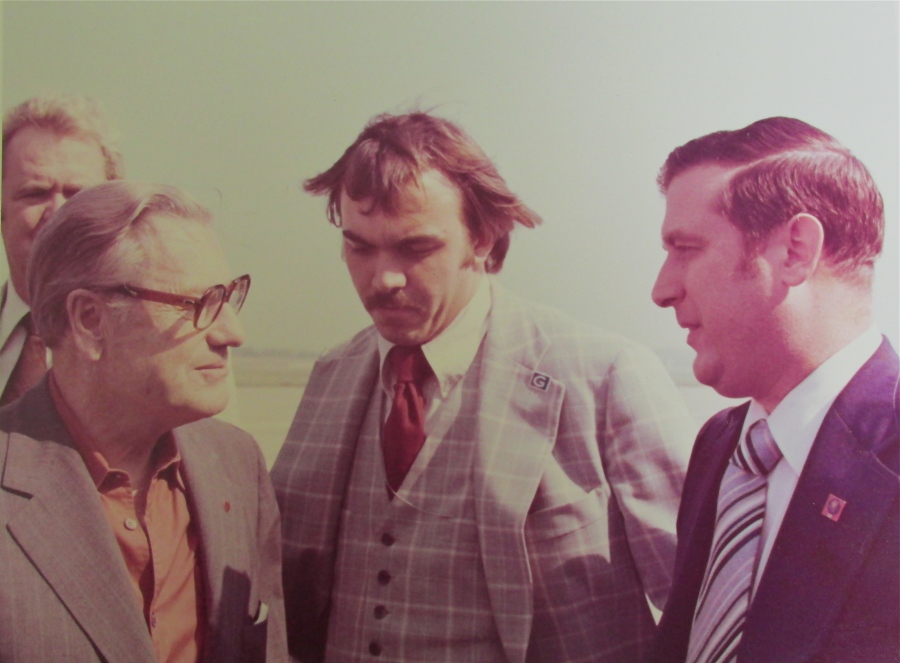  Sgt. Laurent (right) talks with Vice President Nelson Rockefeller during one of his trips to establish worldwide radio communications for the VP. The fellow in the center is a Secret Service Agent. Photo provided